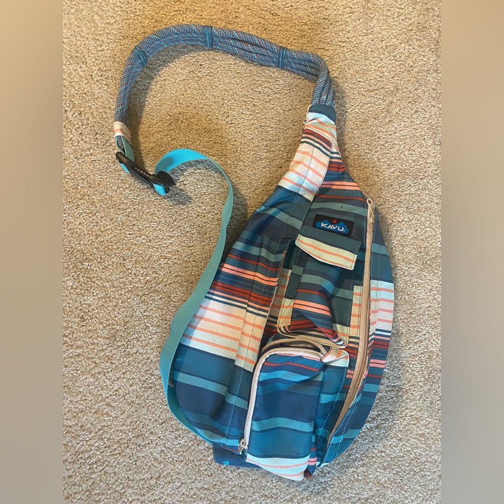 KAVU crossbody bag. Orange and teal. Lots of pockets.
